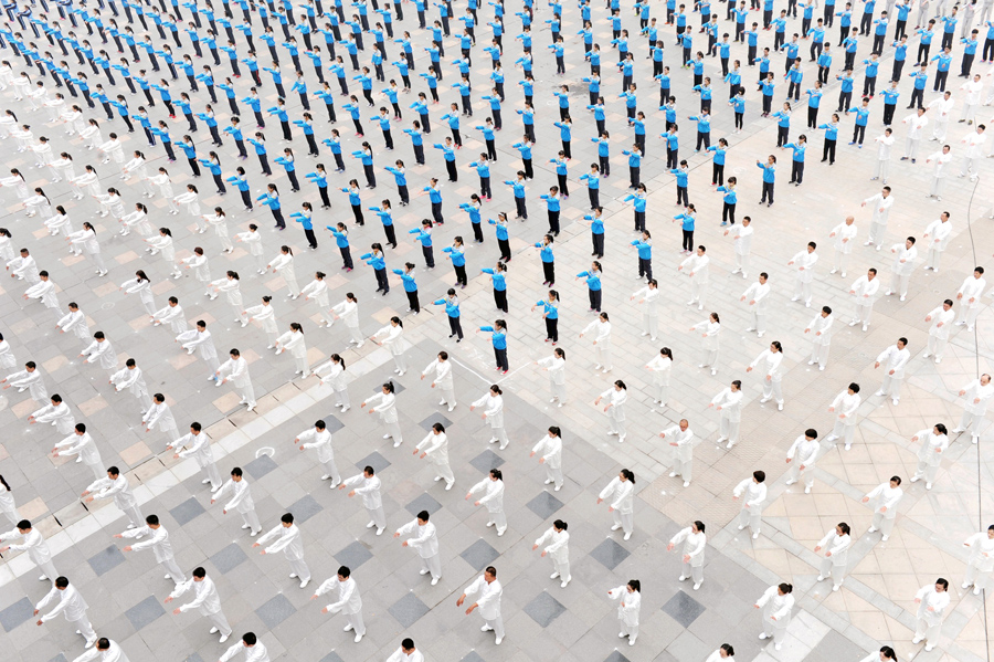 People practice Taichi at a square in Qinyang, Henan province