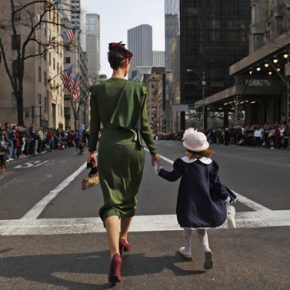A mother and daughter walk down the Fifth Avenue in Manhattan at the Easter Bonnet Parade in New York April 4, 2010.