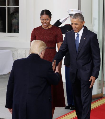 President Barack Obama, accompanied by first lady Michelle Obama, greets President-elect Donald Trump at the White House in Washington, Friday, Jan. 20, 2017.  (AP Photo/Evan Vucci)